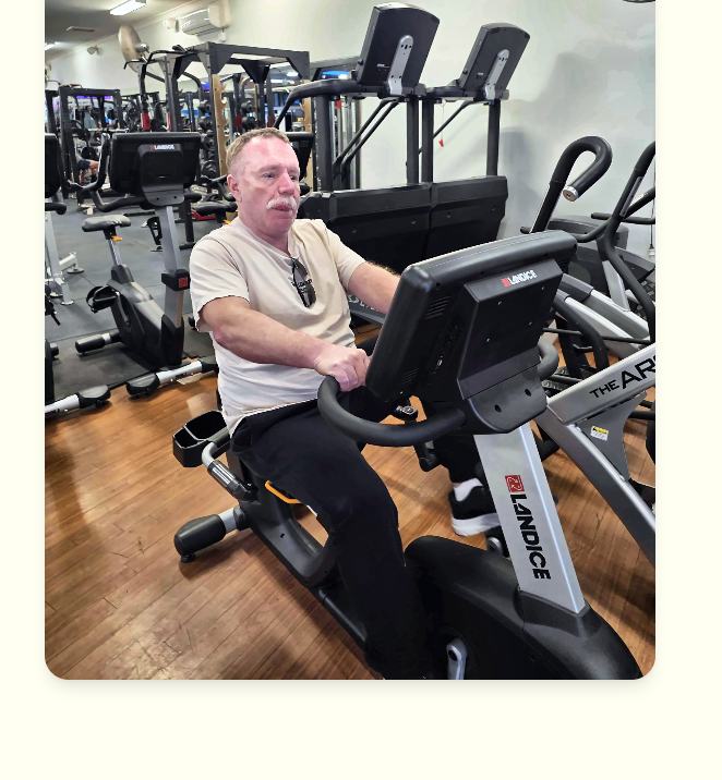Moses on a Landice exercise bike at the gym